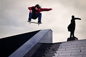 Skateboarder jumping over staircase