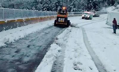 clearing freeway of snow