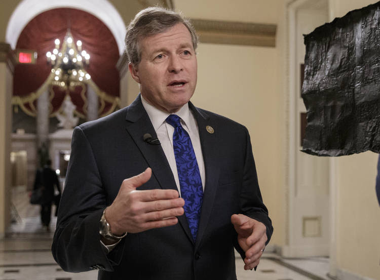 Charlie Dent does a TV hit in the Capitol. (J. Scott Applewhite/Associated Press)
