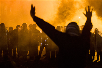 Baltimore police attempt to enforce a curfew on April 28, 2015. AP
