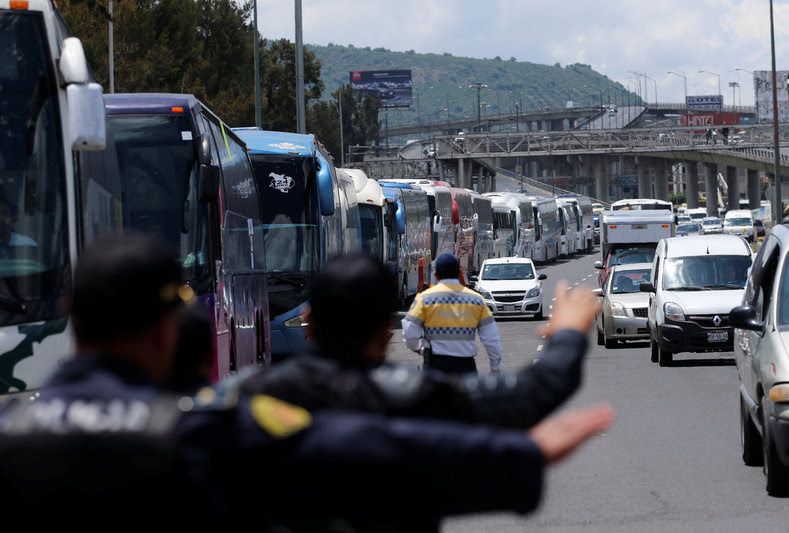 Protesters from the National Coordinator of Education Workers (CNTE) teachers’ union march against President Enrique Peña Nieto