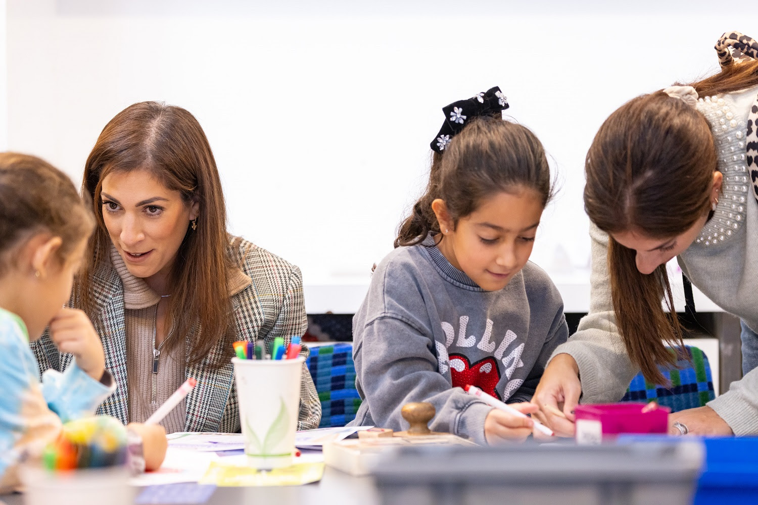 Two parents and two children doing a craft activity together