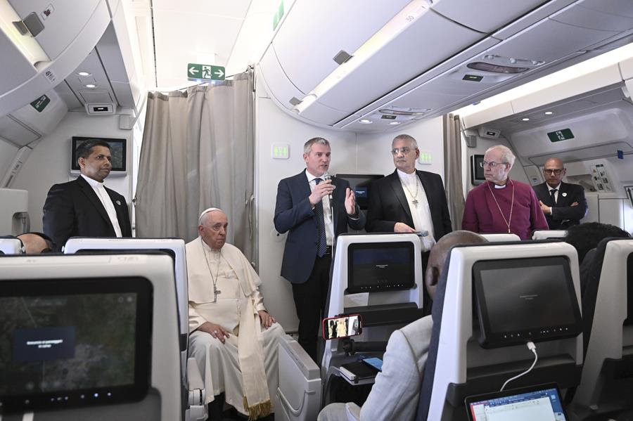 The Archbishop of Canterbury Justin Welby, right, Pope Francis,left, and the Moderator of the General Assembly of the Church of Scotland Iain Greenshields meet the journalists during an airborne press conference aboard the airplane directed to Rome.