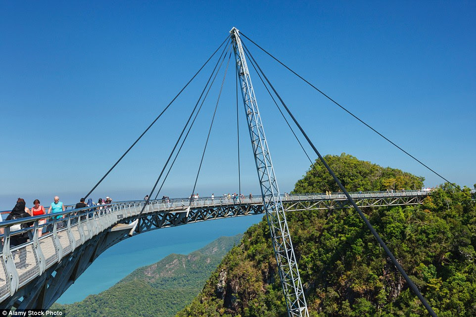Completed in 2004, the Langkawi Sky Bridge is built on top of the Machinchang mountain in Malaysia and hangs at about 328 ft above the ground. The walkway can accommodate up to 250 people at the same
