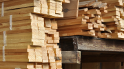 Boards stacked in a lumber yard. 