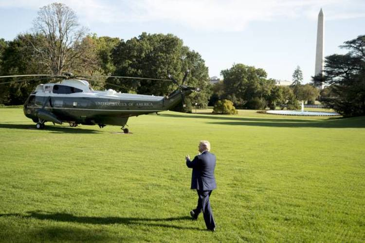 President Trump walks across the South Lawn of the White House on Thursday afternoon to board Marine One. (Andrew Harnik/AP)