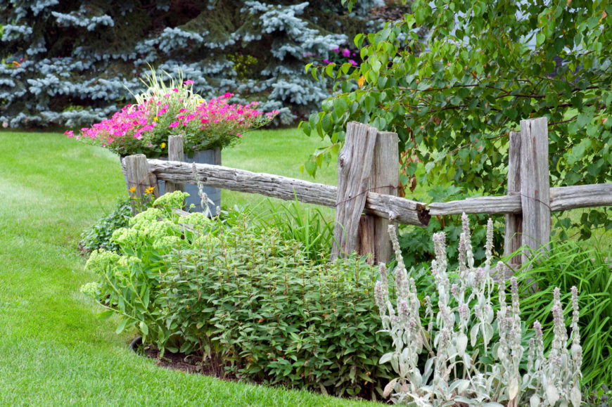 A simple farmhouse with low maintenance landscaping including a well aged split rail fence no more than 3 feet high. 28 Split Rail Fence Ideas For Acreages And Private Homes Wooden World Woodworks