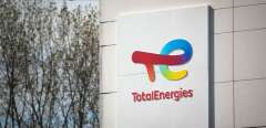 (FILES) In this file photo taken on October 10, 2022 the logo of TotalEnergies is seen at the Total Energy refinery site, in Gonfreville-l'Orcher, near Le Havre, northwestern France. - A liter of gasoline or diesel will be capped at 1.99 euros this year in TotalEnergies' network of some 3,400 service stations in France, its CEO announced on February 22, 2023, who was under pressure from French President to make a "move." (Photo by Lou BENOIST / AFP)